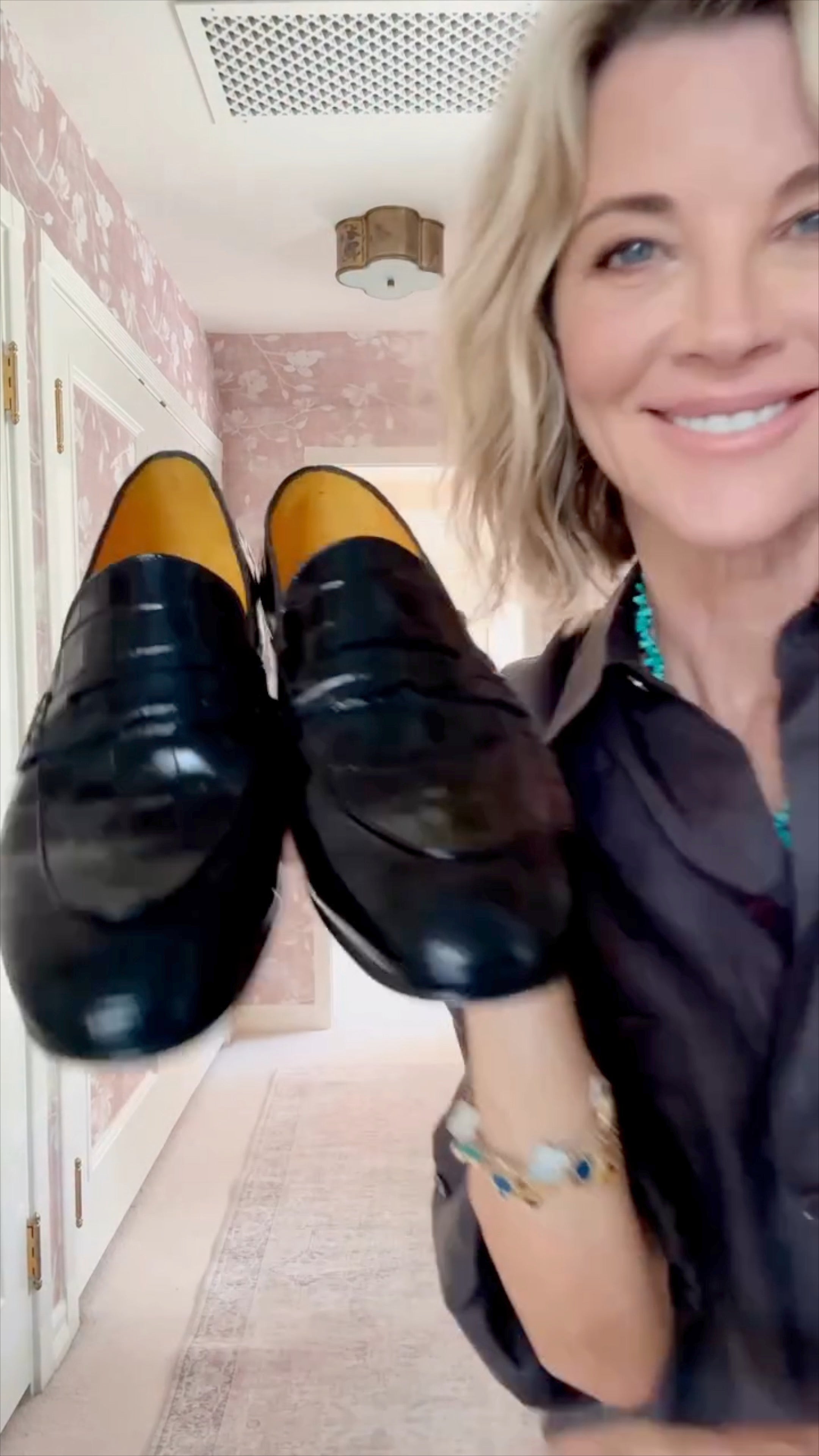 women janet gunn showing off her new croc loafers and what they pair well with 