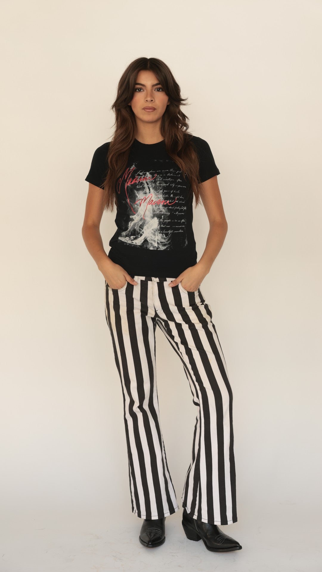 Madison Maison art tee with black, white, and red graphic, styled with black-and-white striped wide-leg pants.