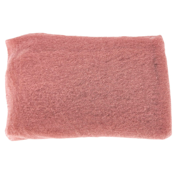 Blush pink cashmere stole, plain woven fabric folded into a rectangle