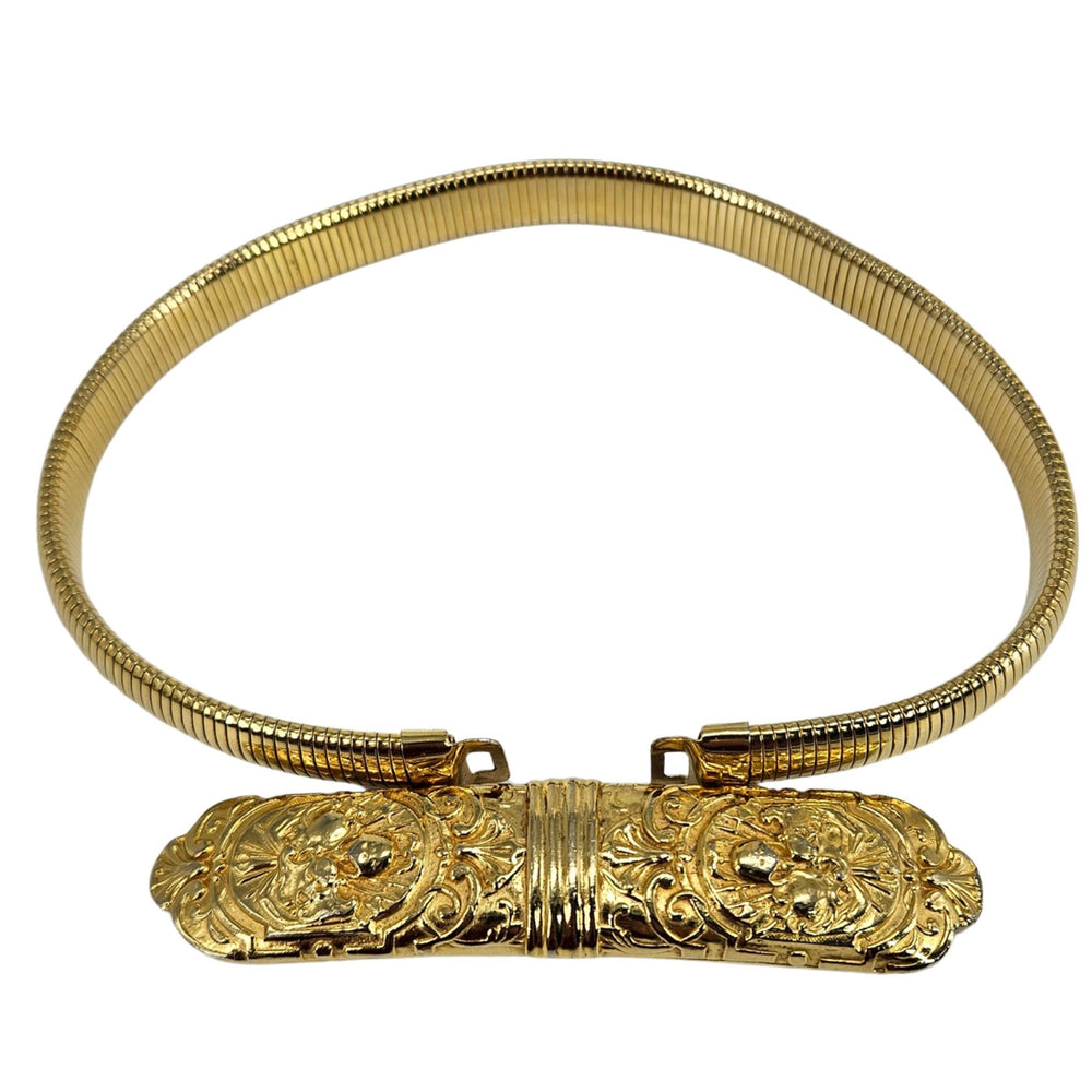 Gold stretch snake belt, ornate engraved bar center with ribbed strap loops