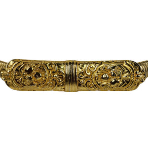 Gold stretch snake belt close-up of engraved filigree center panel with gems