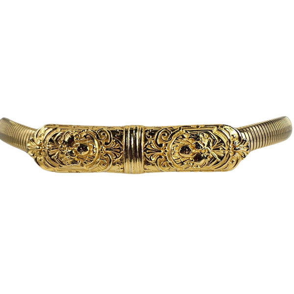 Gold stretch snake belt with detailed filigree center panel and ribbed ends