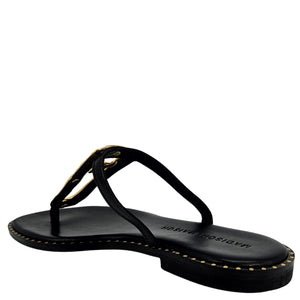 Black leather flat sandal with open toe and hammered gold link across the instep