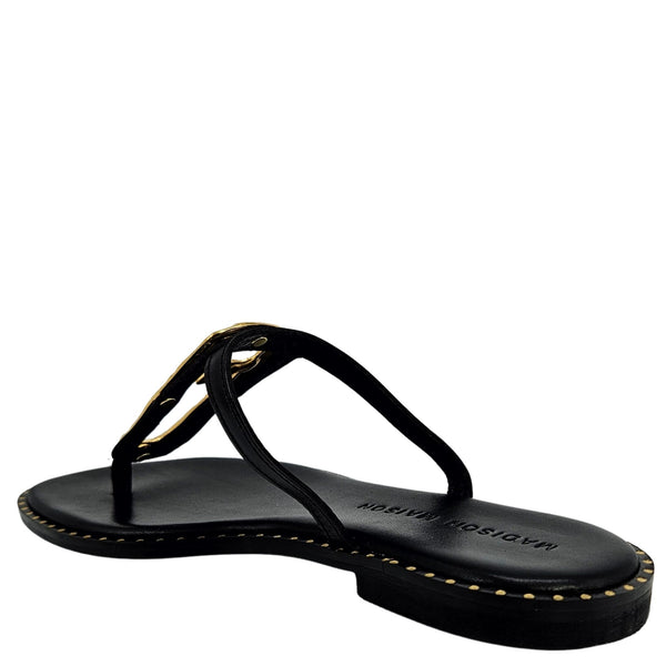 Black leather flat sandal with open toe and hammered gold link across the instep