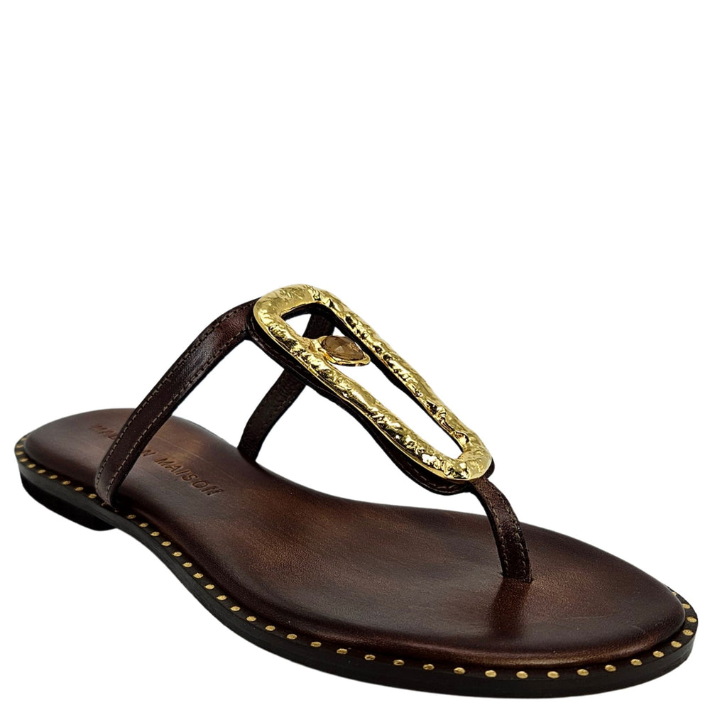 Brown leather flat thong sandal with gold hammered link buckle and stitched edge