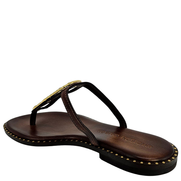 Brown leather flat thong sandal with gold hammered link accent and studded side edge