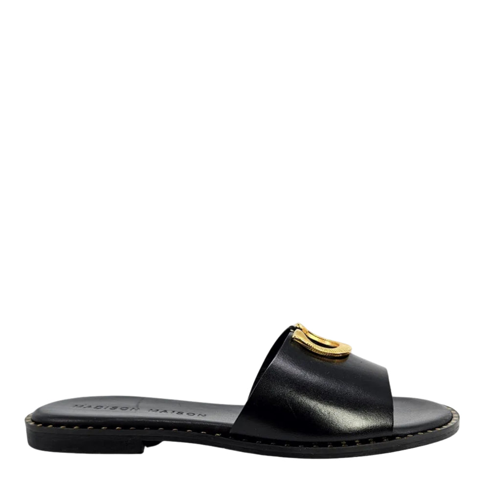 Black leather flat sandal with gold horseshoe buckle