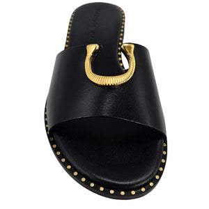 Black leather flat sandal front view with gold horseshoe buckle