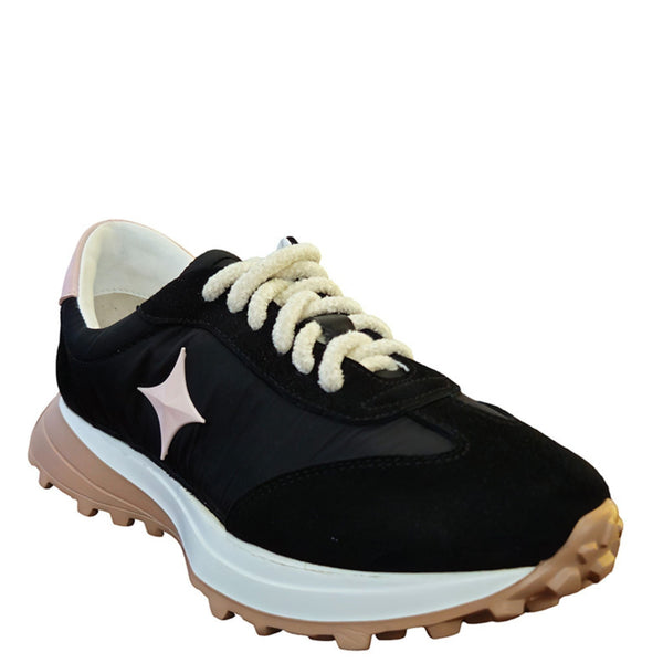 Black jogger sneaker with white star patch, cream laces, side profile on blue-tan sole