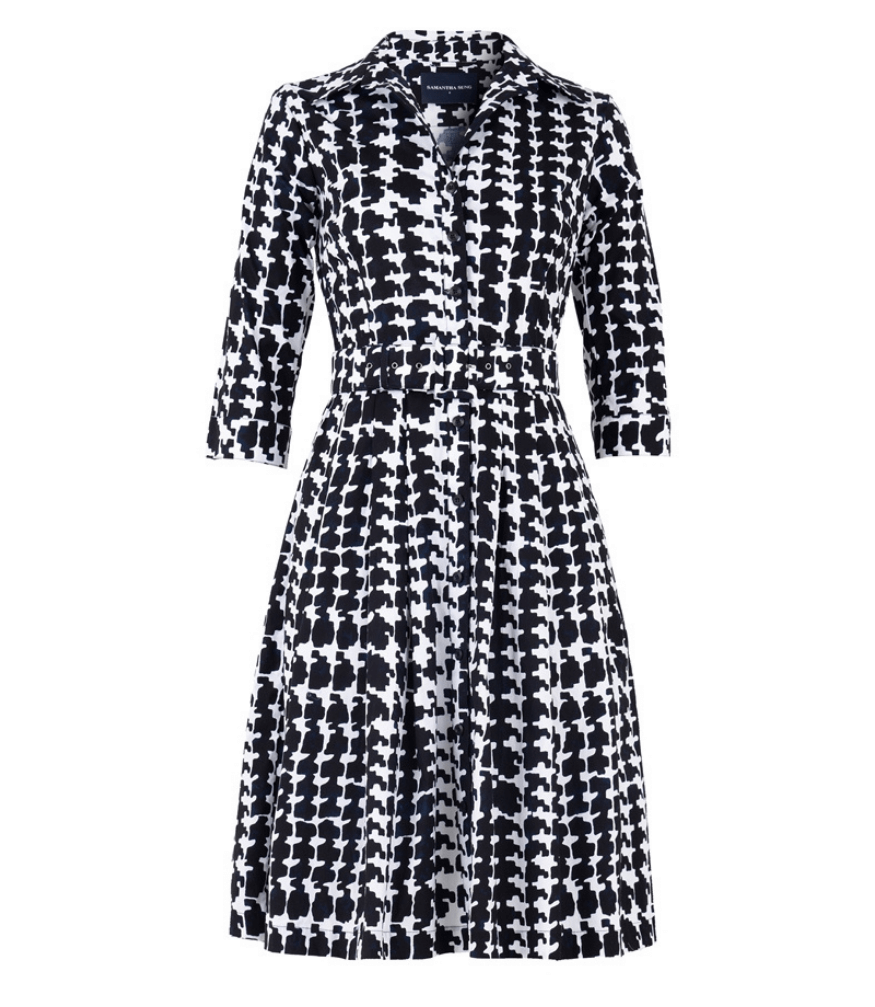 Black-and-white patterned long-sleeve dress with V neck collar and defined waist
