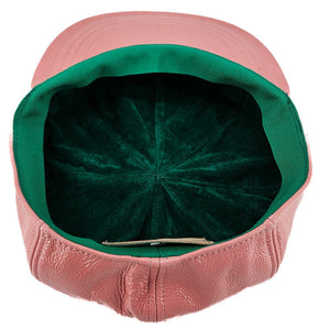 Pink leather motorcycle hat with green fabric lining and stitched interior