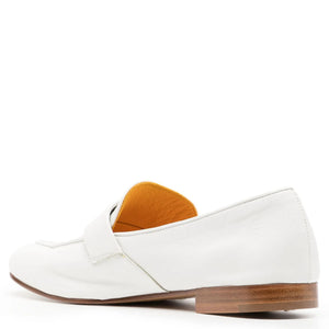 White leather flat loafer back/heel view with tan lining and brown outsole