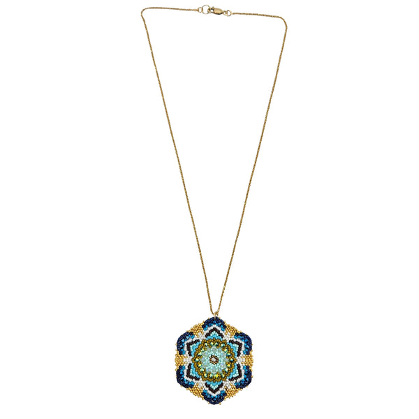 Gold-tone beaded pendant necklace with small blue mandala flower drop