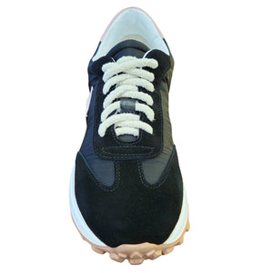 Jogger sneaker front view, black upper with cream laces and thick blue-tan tread sole