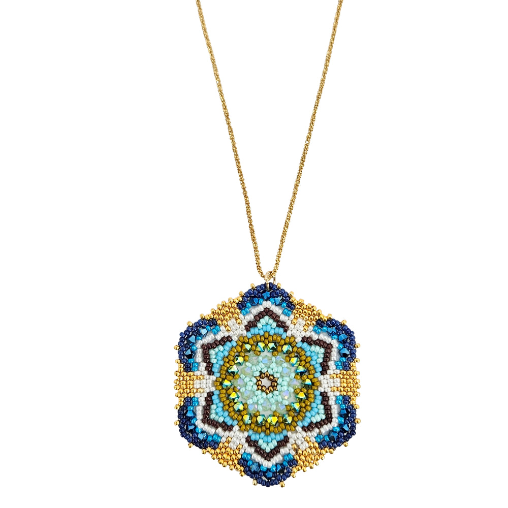 Gold-tone beaded pendant necklace with small blue mandala flower drop