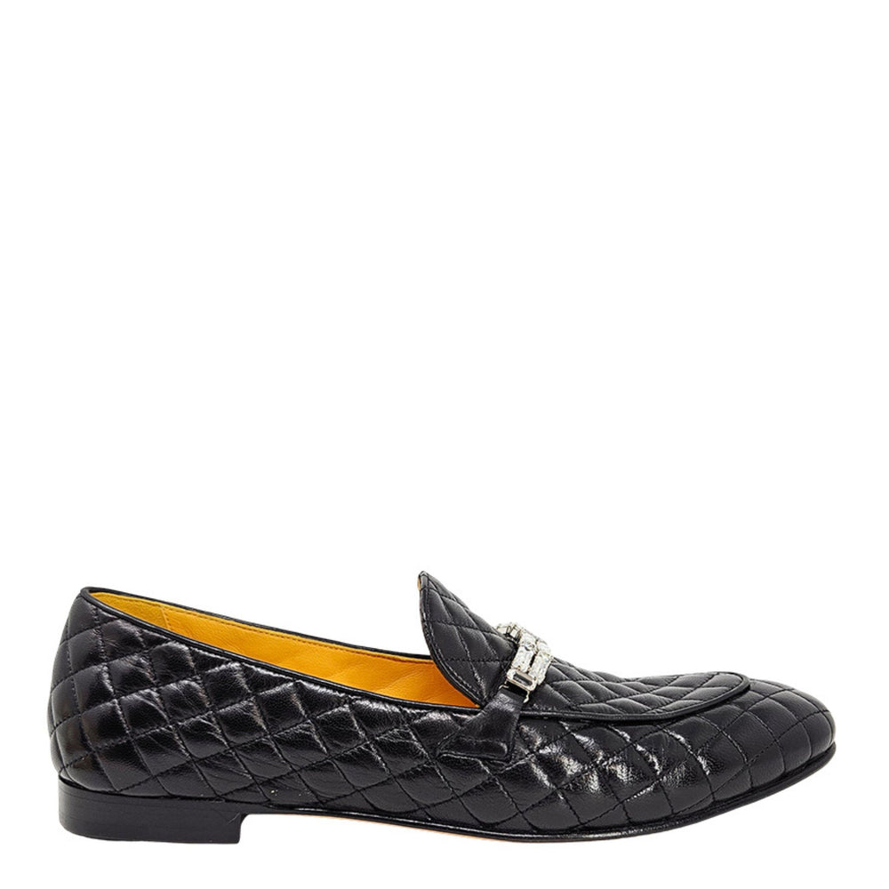 Quilted black flat loafer with slip-on strap and buckle detail