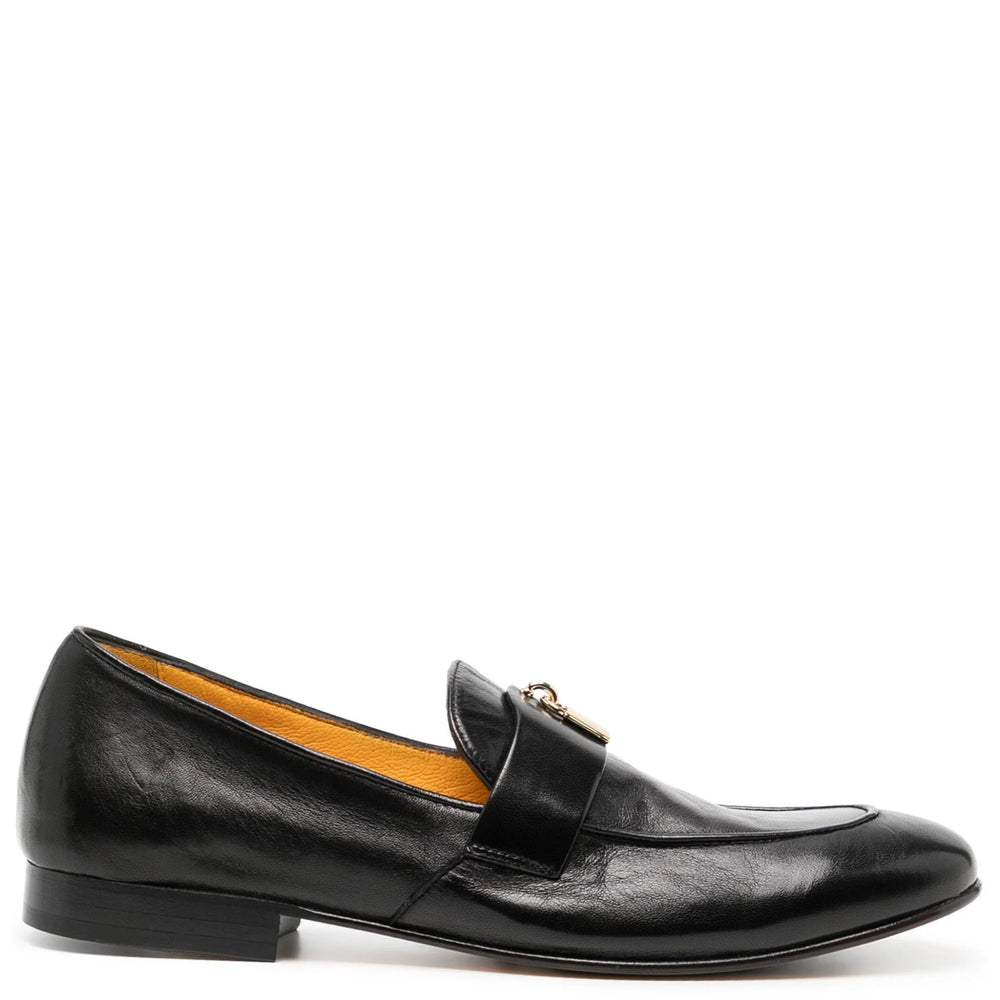 Black leather flat loafer with metal lock detail and moc toe stitching