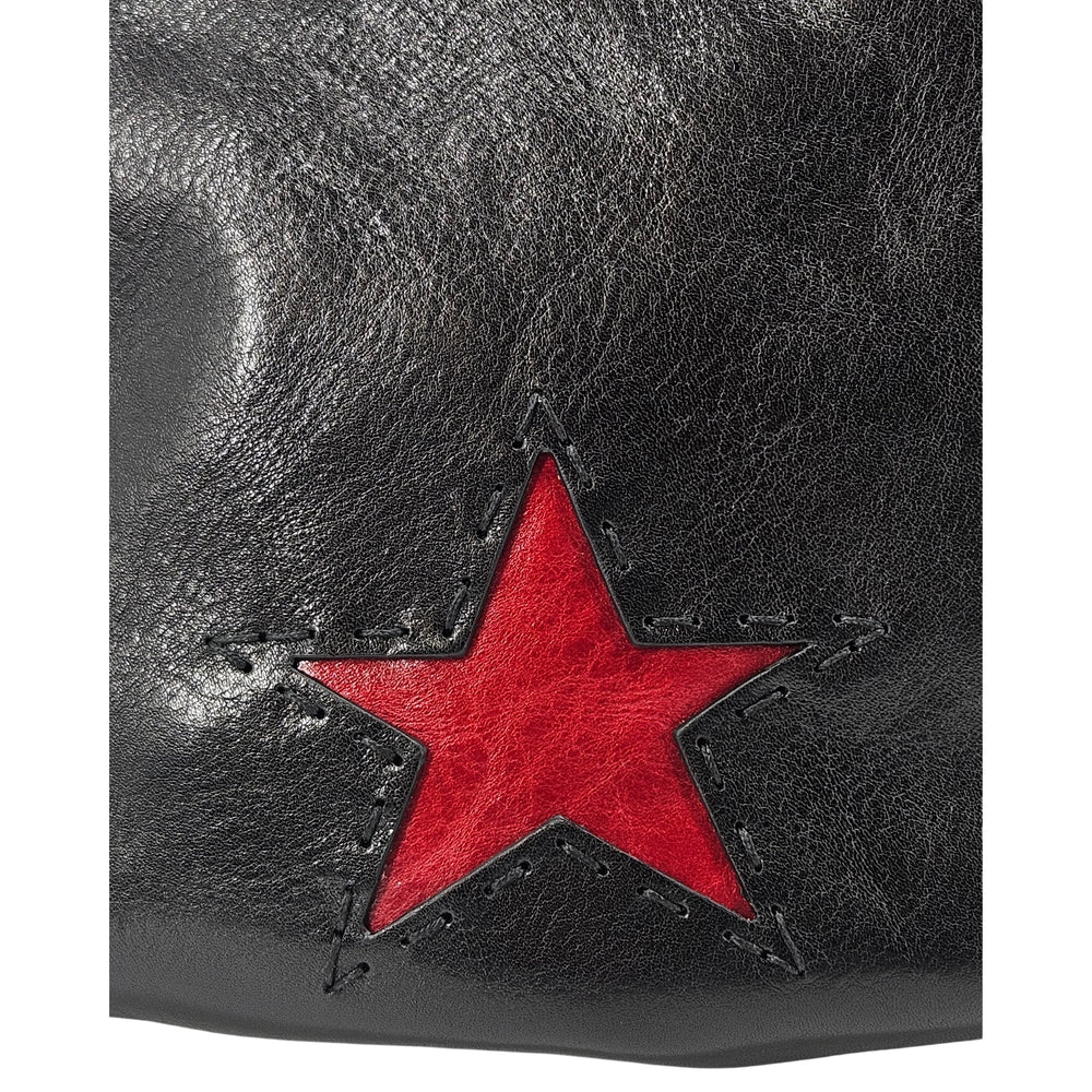Black leather shoulder bag with a red star accent and adjustable strap