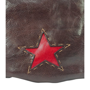 Brown leather bag front with red star patch and decorative stitching
