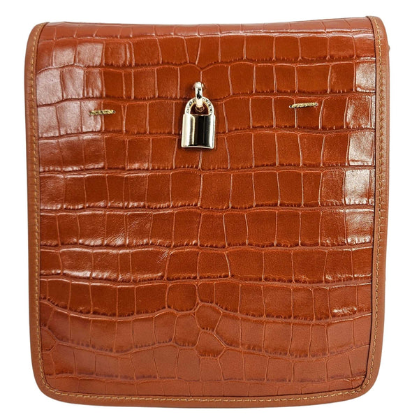Tan croc-embossed leather crossbody bag with top flap and silver clasp lock