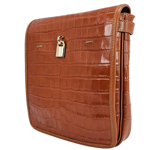 Tan croc-embossed leather crossbody bag with front flap, side strap, and metal clasp
