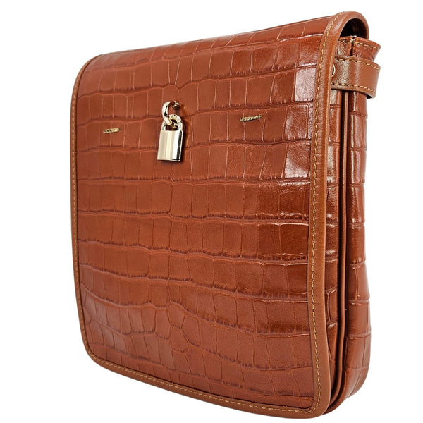 Tan croc-embossed leather crossbody bag with front flap, side strap, and metal clasp