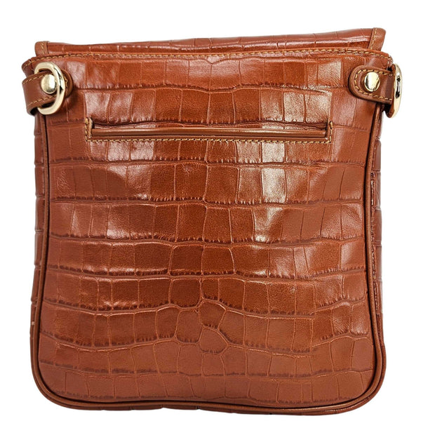 Tan croc-embossed leather crossbody bag with front zipper and metal pull, side rings