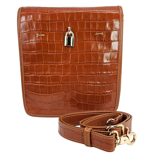 Tan croc-embossed leather crossbody bag with front flap and adjustable shoulder strap