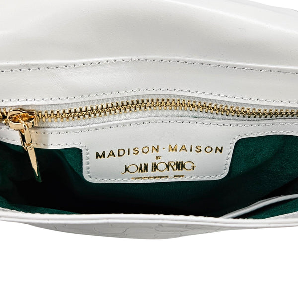 Off-white leather crossbody bag interior with gold zipper and brand label