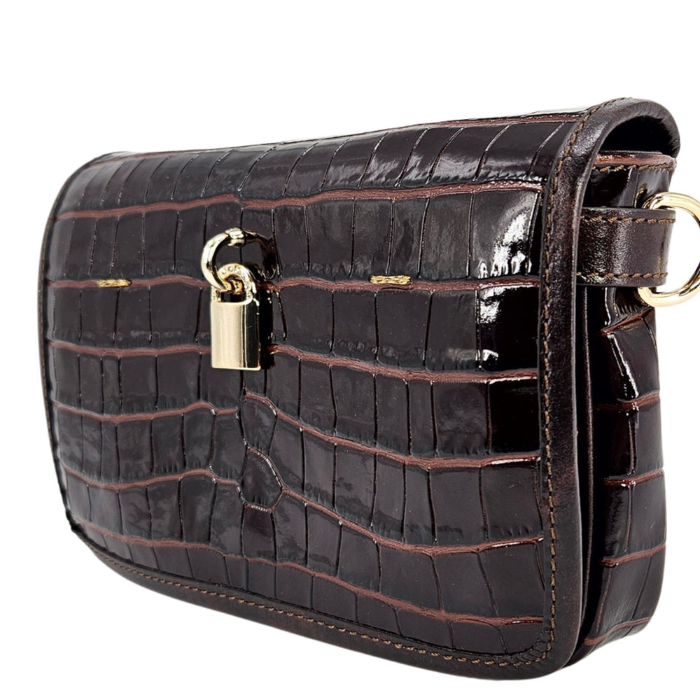 Small dark-brown croc-embossed leather crossbody bag, front view with gold padlock clasp