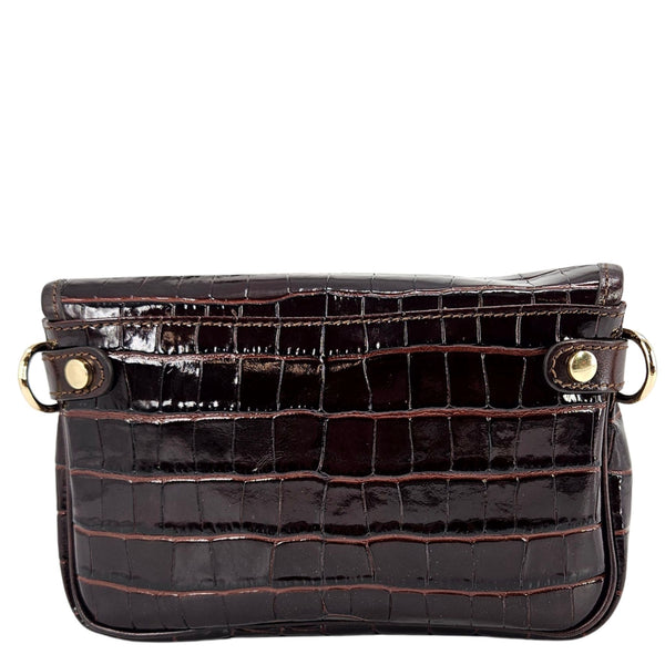 Small dark-brown croc crossbody bag with top flap, snap buttons, and gold hardware
