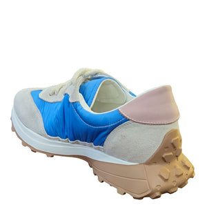 Light blue and gray lace-up sneaker with star patch, chunky sole, heel view