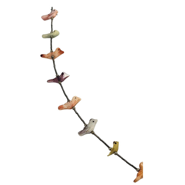 Vintage mother-of-pearl bird necklace angled view, colorful bird charms on chain