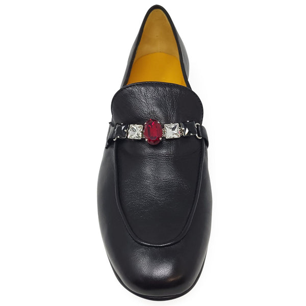 Black leather slip-on loafer with red gem centerpiece and silver details