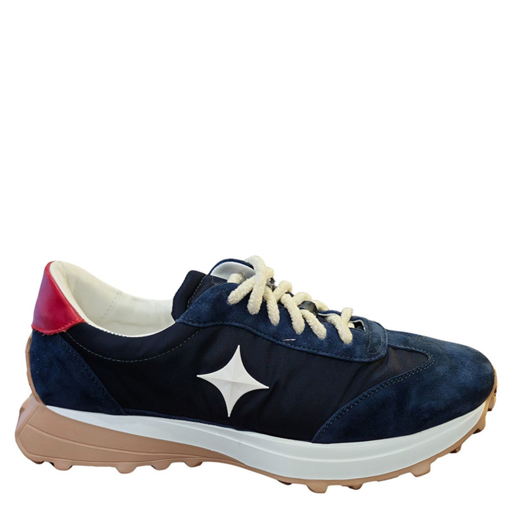 Navy suede jogger sneaker with white star logo, cream laces, red heel tab, tan sole