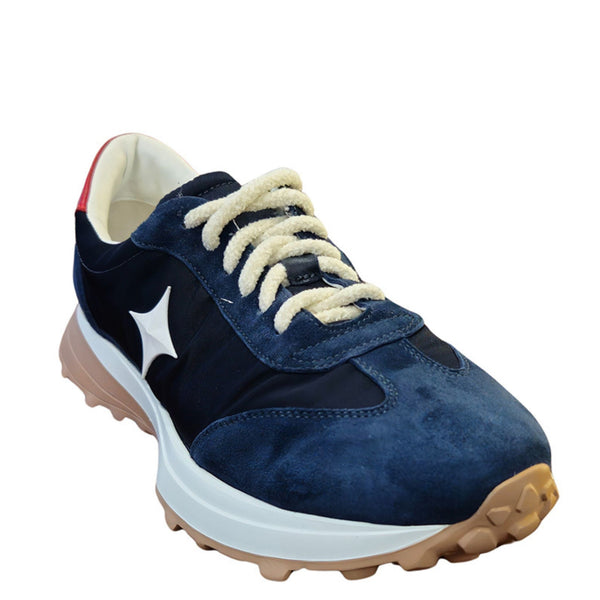 Navy jogger sneaker with white star logo, cream lace-up, tan tread outsole
