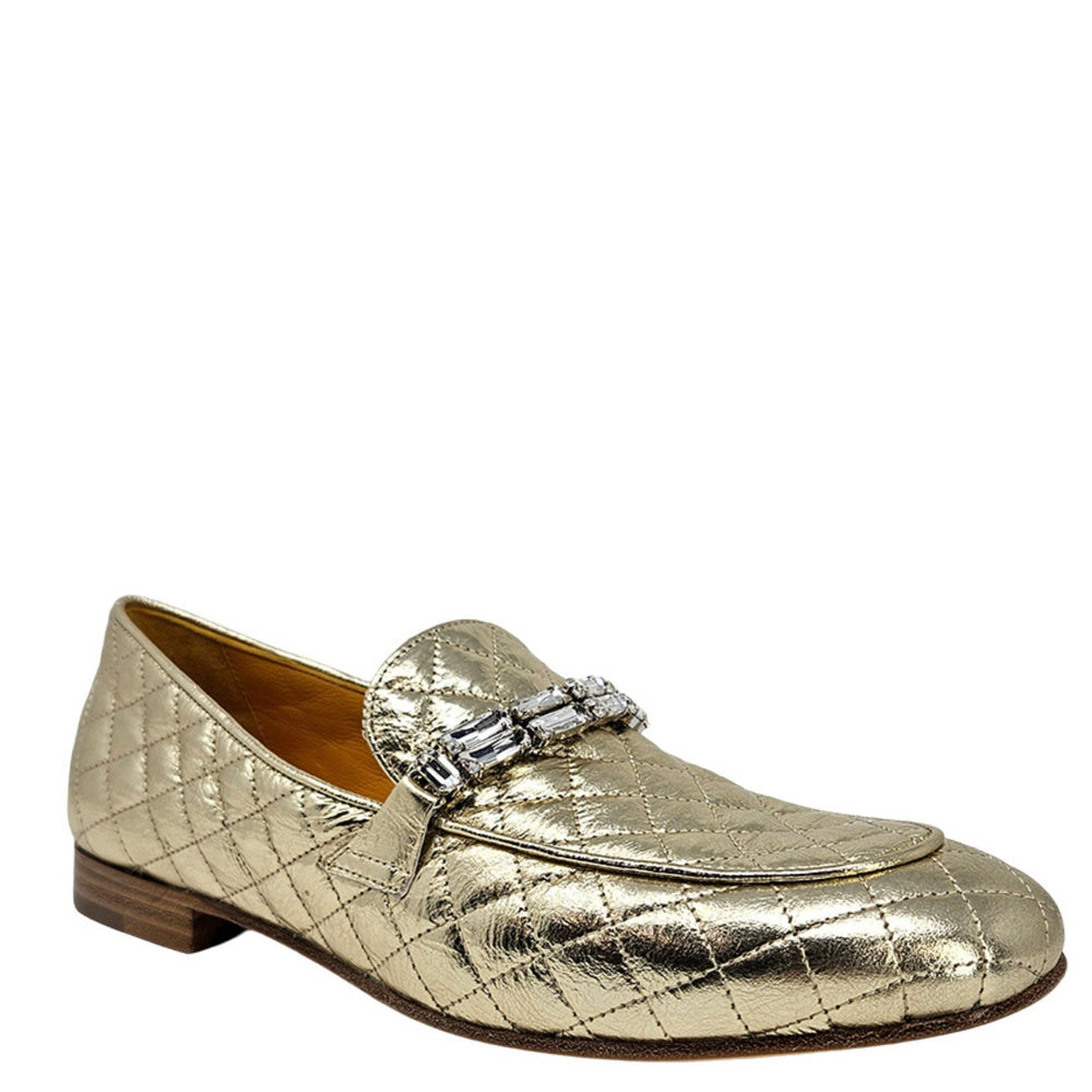 Gold quilted flat loafer with jeweled buckle ornament and low brown sole