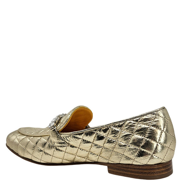 Gold quilted flat loafer with jeweled strap detail and brown low heel