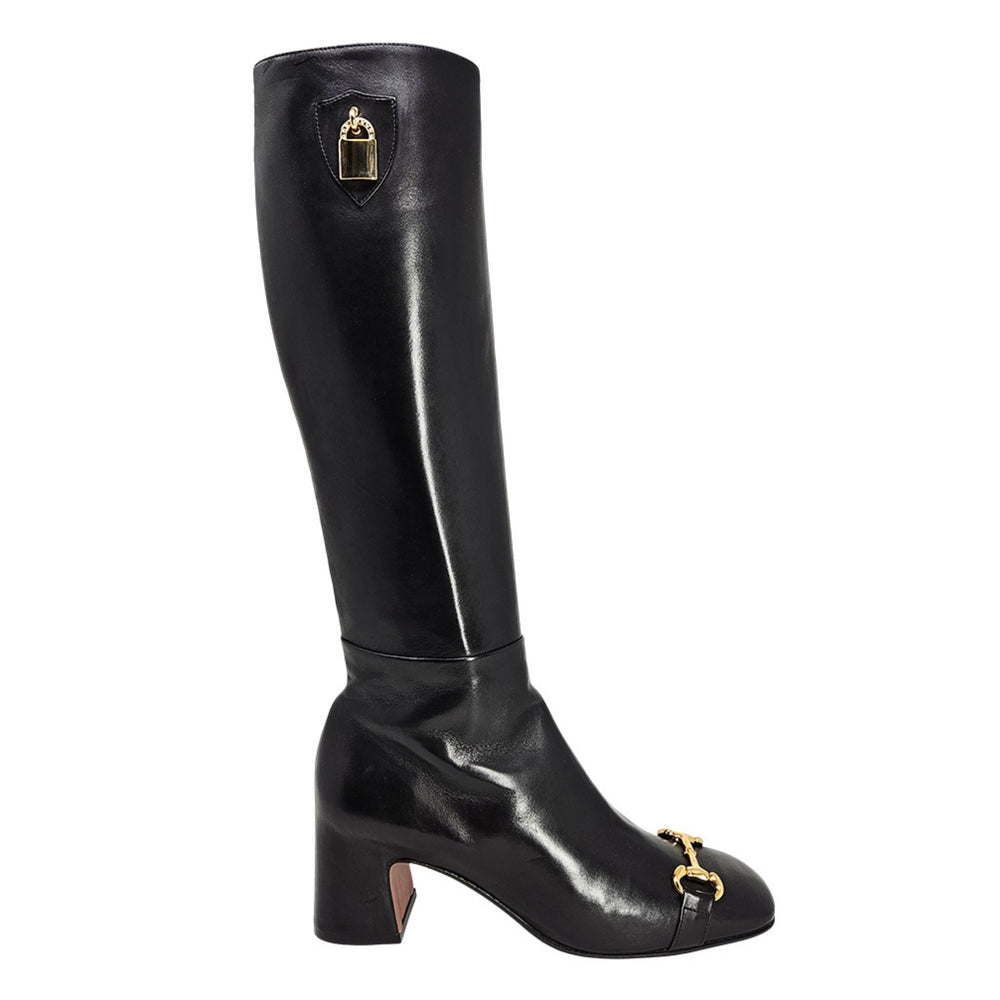Black tall lock boot with gold lock hardware and low block heel