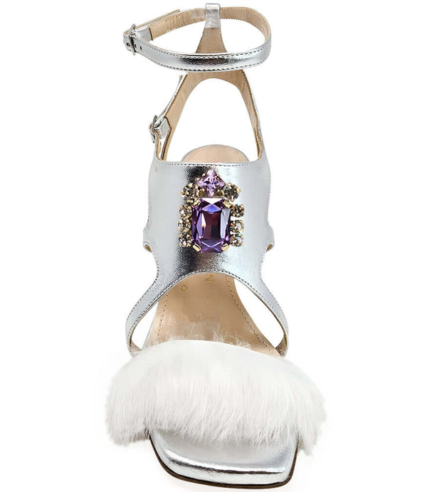 Silver open-toe high heel sandal with ankle strap, purple gem front, and white feather trim