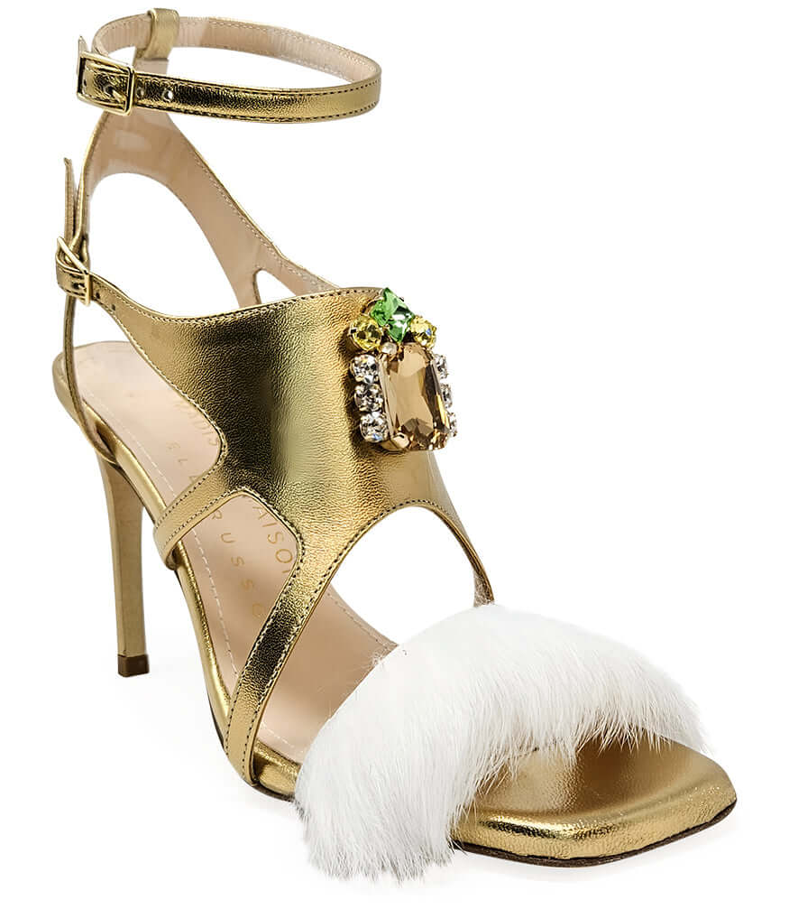Gold leather open-toe pump with ankle strap, feather trim at toe, stiletto heel