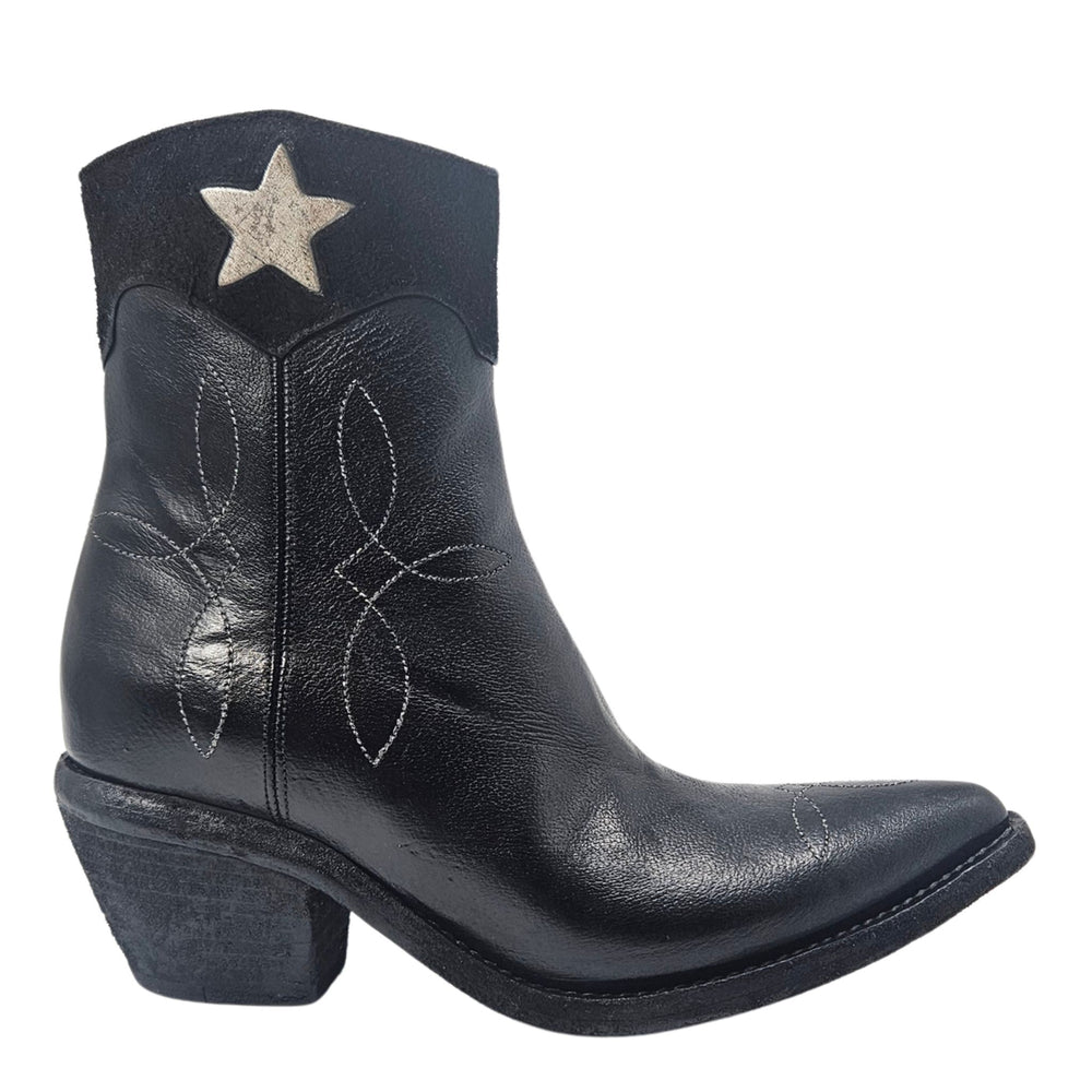 Black leather ankle boots with pointed toe and star patch on shaft