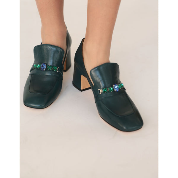 Green leather mid-heel loafer worn by model; jewel strap at vamp and chunky heel