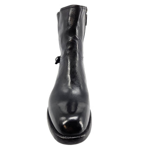 Mid-calf leather boot toe view with glossy dark finish and low sole