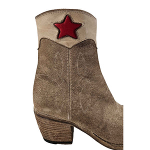 Beige suede ankle cowboy boots with bold red star at shaft and stacked block heel