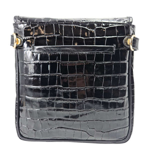 Black croc-embossed leather crossbody bag front with flap, snap rings, and gold accents