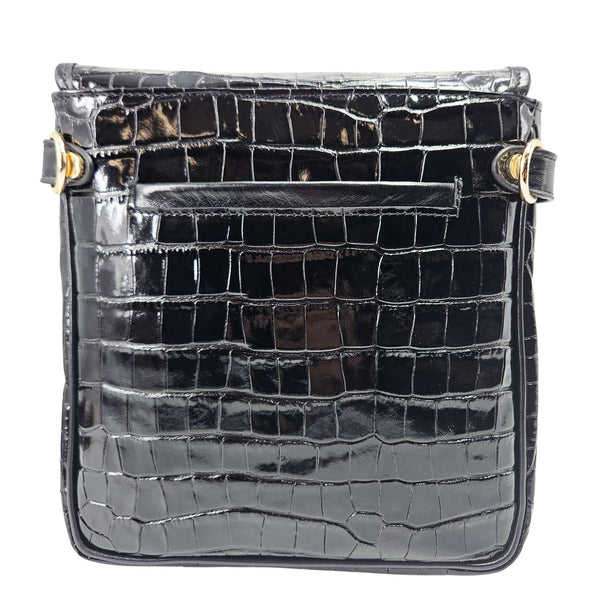 Black croc-embossed leather crossbody bag front with flap, snap rings, and gold accents