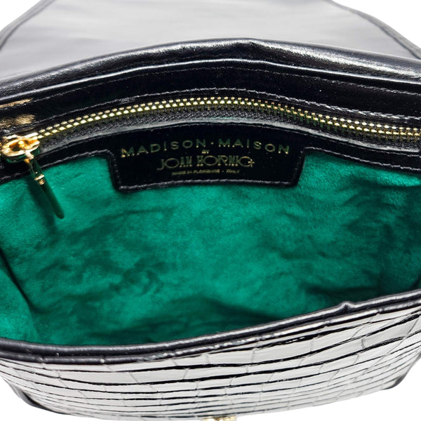 Black croc-embossed crossbody bag interior with green lining and gold zip trim