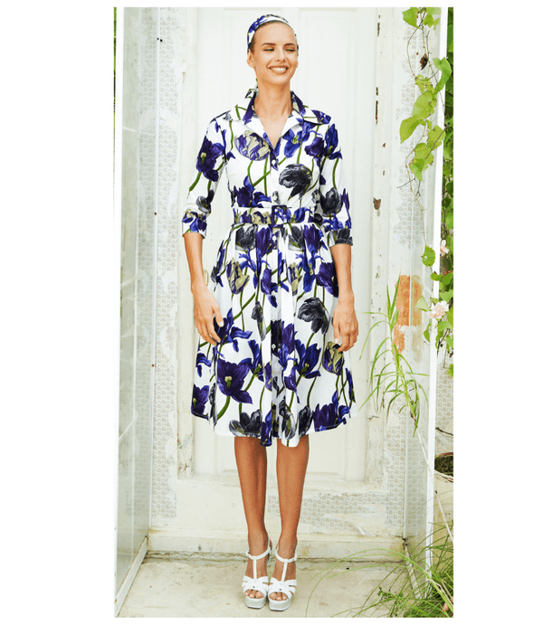 White long-sleeve tulip-print dress with belted waist and button-front collar