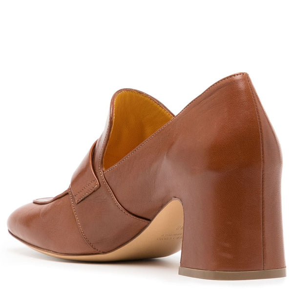 Tan leather loafer with pointed toe, lock-style strap, and structured block heel